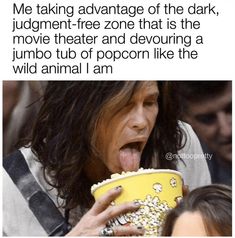 an image of a woman eating popcorn with her tongue out and the caption reads, me taking advantage of the dark