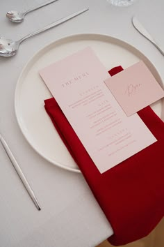 a white plate topped with a red napkin