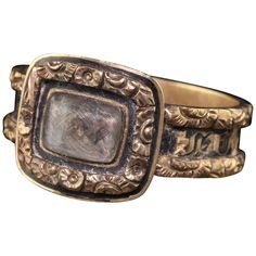 Beautiful Antique Victorian 14K Yellow Gold Engraved Black Enamel Mourning Ring. This gorgeous ring has engraved and enameling going around the entire ring. The center has an acrylic glass that is holding the hair in the center. The enamel has some loss to it but it is still in good condition. This does not have any engravings or dates in the ring. Item #R0747 Metal: 14K Yellow Gold Size: 7 1/2 Weight: 3.7 Grams Measurements: 11.4 mm wide Layaway: For your convenience, we will be happy to provid Plaited Hair, Medieval Rings, Gorgeous Ring, Gothic Rings, Gold Engraving, Antique Rings, Black Enamel, Antique Victorian, Antique Gold