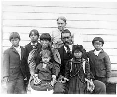 an old black and white photo of a group of people