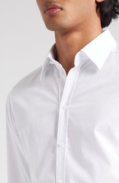 A smart wardrobe essential, this Italian-crafted shirt is cut from pure cotton poplin for a crisp look and easy movement. 30" length; 40 1/2" chest (size 40) Raised placket Point collar Long sleeves with button cuffs 100% cotton Machine wash, line dry Made in Italy Designer Clothing Elegant White Poplin Shirt, Formal Button-up Poplin Tops, Formal Poplin Button-up Top, Elegant Poplin Shirt For Office, Formal White Poplin Tops, Elegant Poplin Tops With Spread Collar, Elegant Poplin Top With Spread Collar, White Poplin Tops For Formal Occasions, Elegant Poplin Shirt With Button Cuffs