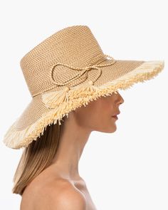 If you are looking for a woman's sun hat for sale online that is sure to turn heads, look no further! Named from the Caribbean Island that has endless beaches and warm turquoise water, this sun hat made of Squishee®, is a show stopper. This flirty, tropical sun hat combines the pinched crown of a fedora with a wide brim, edged all around with glamorous straw fringe. Wherever you adventure, from St. Barths to Antibes, approving smiles are sure to follow! Squishee® straw is a sustainable man-made