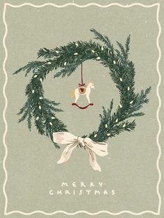 a merry christmas card with an ornament hanging from the top of a wreath