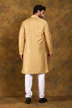 BLUESAANCHI MEN'S GOLDEN EMBROIDERY KURTA SET   The BLUESAANCHI Men's Golden Embroidery Kurta Set is an epitome of elegance and style. Perfect for festive occasions, this traditional outfit is designed to provide comfort with a touch of luxury. Crafted with intricate golden embroidery, this kurta set adds a royal charm to your ethnic wardrobe.  Key Features  Elegant golden embroidery on the kurta  Comes with a matching churidar  Comfortable and breathable fabric  Perfect for festive and special occasions  Available in various sizes   Specifications  Brand: BLUESAANCHI  Color: Golden with embroidery  Style: Kurta Set  Fit: Regular Fit  Available Sizes: S, M, L, XL, XXL   Material & Care  Material: Cotton Silk Blend  Care: Dry Clean Only    Legal Disclaimer:  The product is guaranteed to be Embroidery Kurta, Golden Embroidery, Traditional Outfit, Churidar, Kurta Set, Cotton Silk, Traditional Outfits, Party Wear, Breathable Fabric