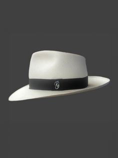 Brand: Gamboa Color: Natural Material: Toquilla Straw Brim: 7 - 7.5 cm. (2.76"- 2.96")Grade: 13 - 14 (Fine Fine)learn more Sweatband: Cotton Twill, 3 cm. (1.18") Crown: 10.37 - 10.87 cm. (4.1" - 4.3") Ribbon: Linen Description: A luxurious hat, handmade in Montecristi, the worldwide famous Panama Hat town in Ecuador. This Panama Diamond hat for men is a top quality, classic and elegant hat. Each hat is individually blocked and trimmed to meet the highest quality standards. Cuban Hat, Poncho Mexican, Panama Hat Men, Poncho Pullover, Cape Wrap, Alpaca Socks, Tagua Jewelry, Alpaca Scarf, Elegant Hats