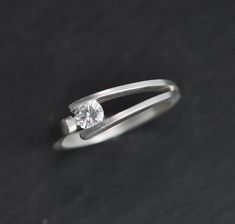 Hey, I found this really awesome Etsy listing at https://www.etsy.com/listing/569812935/tension-set-4mm-moissanite-in-sterling Tension Setting, Diamond Alternatives, Forever One Moissanite, Black Sapphire, Ring Stacking, Everyday Rings, Set Ring, Minimalist Ring, Moissanite Rings