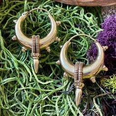 Elevate your style with our Handcrafted Statement Tribal Brass Hoop Earrings, a striking blend of bold design and cultural influence. Meticulously handcrafted, these earrings capture the essence of tribal aesthetics, making them a powerful accessory for those who appreciate unique, statement pieces. Material: High quality brass. Width- 1 /4 inches   Length - 2 inches. 🔶🌟 **Key Features - **Artisanal Craftsmanship Each pair is expertly crafted, ensuring intricate detailing and a one-of-a-kind design. - **Statement Tribal Design The bold brass hoops draw inspiration from tribal motifs, making these earrings a standout accessory. - **Versatile Statement Piece Whether for everyday wear or special occasions, these earrings make a powerful style statement. - **Secure Closure The well-designed Traditional Small Hoop Nickel-free Jewelry, Nickel-free Traditional Small Hoop Earrings, Bohemian Bronze Single Earring, Traditional Festival Plug Earrings Nickel Free, Bronze Bohemian Earrings With Ear Wire, Bohemian Bronze Earrings With Ear Wire, Traditional Pierced Brass Earrings, Traditional Nickel Free Small Hoop Earrings, Bohemian Brass Dangle Earrings