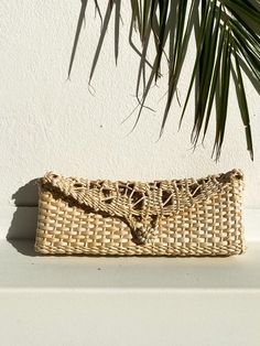 Absolutely Gorgeous clutch handmade 100% of Palm Leaves.  Lightweight and comfortable handwoven straw clutch bag. It features a beautiful natural straw color and it has a front loop for closure.  This is a great bohemian clutch bag, perfect for a beach party or wedding and a great addition for your next vacation wardrobe. It Also makes a stylish gift. Color: Natural Measurements: Length: 12"/30,5 cm Width: 1.5"/4 cm Height:5"/12,7 cm  Made in Brazil Handmade by local craftsman in the countryside Straw Crochet Clutch Bag For Beach, Straw Clutch Bag For Vacation, Handwoven Clutch Straw Bag For Vacation, Handwoven Straw Clutch For Vacation, Woven Straw Pouch Bag, Woven Crochet Clutch Bag For Vacation, Rectangular Straw Clutch In Natural Color, Handmade Pouch Straw Bag For Vacation, Natural Straw Rectangular Clutch