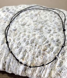 "Stylish and effortless 0.5mm black leather cord Necklace with moonstone or seaglass pendant . It is very comfortable and stand out! If this is too dainty for you please check out the thicker and bigger version: https://www.etsy.com/listing/536000591/dark-brown-leather-cord-lace-knocked?ref=shop_home_active_9 Or the match bracelet: https://www.etsy.com/listing/543430942/leather-cord-lace-knocked-with-hill?ref=shop_home_active_1 Each necklace is around 22\" and have double knot you can adjust the Minimalist Jewelry With Adjustable Waxed Cord, Minimalist Adjustable Waxed Cord Jewelry, Black Beach Jewelry With Adjustable Cord, Simple Adjustable Choker As Gift, Minimalist Black Jewelry For The Beach, Minimalist Black Jewelry For Beach, Minimalist Adjustable Necklaces For Beach, Minimalist Waxed Cord Jewelry As Gift, Minimalist Handmade Choker For The Beach