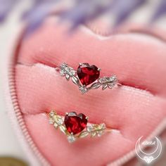 Cue the romance with our stunning Heart’s Desire Red Garnet Ring. This perfect expression of true love features a heart-shaped red garnet center stone along with a curved white topaz leafy band that adds a natural charm. A cherished keepsake that radiates love from every angle. ✦ Available in both 14K yellow gold vermeil (14K yellow gold plated over a sterling silver base) and 10K solid yellow gold. Red Diamond Heart Ring For Wedding, Wedding Red Diamond Heart Ring, Red Heart Shaped Wedding Rings, Red Heart Ring With Center Stone, Red Diamond Heart Shaped Ring, Fine Jewelry Red Heart Ring For Anniversary, Red Heart Ring For Anniversary In Fine Jewelry Style, Red Diamond Heart-shaped Ring, Heart Shaped Red Ruby Ring For Wedding