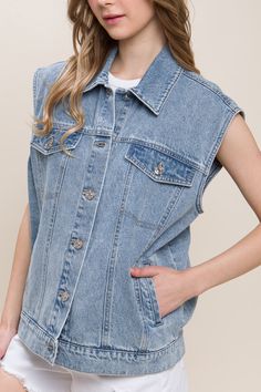 DetailsA denim vest featuring a boxy fit, collar, and functional pockets 100% cotton Trendy Dark Wash Vest With Pockets, Sleeveless Cotton Denim Jacket With Pockets, Trendy Medium Wash Cotton Vest, Spring Washed Denim Vest For Workwear, Spring Washed Denim Vest For Work, Trendy Blue Denim Vest For Workwear, Trendy Sleeveless Denim Jacket In Medium Wash, Sleeveless Denim Vest With Pockets, Trendy Sleeveless Medium Wash Denim Jacket