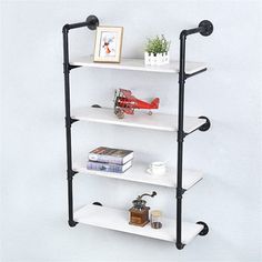 three tiered shelving unit with black pipes and white shelves