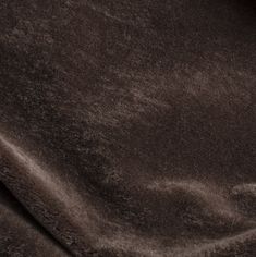 a close up view of a brown velvet fabric with very thin lines on the edges