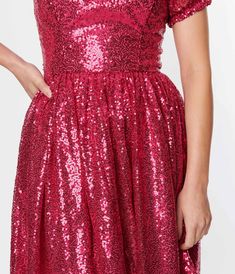 This dazzling dress is perfect for those who want to turn heads and make a statement. The hot pink sequins shimmer and shine, ensuring that you'll be the center of attention wherever you go. With its fit & flare silhouette, this dress is designed to flatter all body types by cinching at the waist and flowing out into a twirl-worthy skirt. The woven fabric feels luxurious against your skin, while the back zipper ensures an easy and seamless fit. Short sleeves with elastic cuffs add a touch of pla Dazzling Dress, Shimmer And Shine, Shimmer N Shine, Pink Sequin, Xl Dress, Fit Flare Dress, Fit & Flare, Sweetheart Neckline, Flare Dress