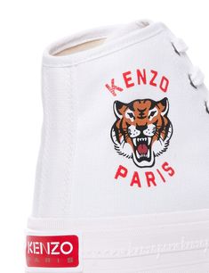 Kenzo high-top sneakers made of cotton canvas and decorated with Kenzo Lucky Tiger logo print on the outer side. Rubber toe, silver-tone metal eyelets. cotton interior with lightly padded insole and rubber sole featuring embossed signature along the sides and logo patch on back.Heel height: 3,5 cmGender: WOMENMaterial: 100% COTTONColor: WHITEMade in: VNProduct ID: FE52SN025F76 01*Import tax/duty will be calculated at checkout (If applicable) Lucky Tiger, Tiger Logo, Hightop Sneakers, High Sneakers, Prada Leather, Sneaker Wedge, Yoga Wear, Chic Design, Bridal Shoes