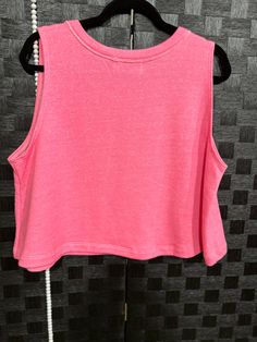 Get ready to rock your style with this hot pink terry tank top featuring a playful white bow graphic. Trendy Pink Workout T-shirt, Sporty Sleeveless Top For Loungewear, Trendy Crop Top Tank For Loungewear, Trendy Sleeveless Crop Top For Loungewear, Trendy Pink Sleeveless Tank Top, Cotton Athleisure Tops With Scoop Neck, Pink Crew Neck Tank Top For Spring, Spring Pink Crew Neck Tank Top, Summer Crew Neck Tank Top For Loungewear