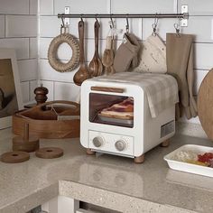 a kitchen counter with an oven and various cooking utensils