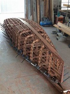 a wooden boat being built in a workshop