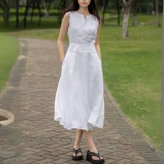 Keep it fresh and fashionable this summer with our Linen Midi Dress. This sleeveless, split neck white dress, perfectly designed for those hot summer days, ensures you stay comfortable while looking chic.  ★★FEATURES 100% Linen Two side pockets White cotton lining Split V neck dress Right hidden zipper Sleeveless Linen dress Linen midi dress Below knee length Minimalist Dress Perfect for summer,spring Other more color selection ★★ Bespoke Order Service If you Request other color Request the leng Casual White A-line Maxi Dress, White V-neck Sleeveless Dress For Summer, White Sleeveless Summer Dress For Day Out, White Sleeveless Dress For Summer Day Out, White A-line Sleeveless Dress For Day Out, Sleeveless Linen Dress In Solid Color, White Sleeveless Linen Sundress, Sleeveless Solid Color Linen Dress, White Sleeveless Sundress