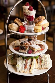 three tiered trays holding pastries and desserts