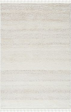 a white rug with wavy lines on the bottom, and an area that has been made from