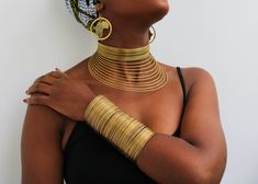 African Brass necklace, Brass Choker Necklace, Statement Necklace, Brass jewelry, One size fits all, Christmas Gift for her, Moms gift The necklace is handmade using brass wire The necklace is adjustable hence can fit any neck size. The brass jewelry set includes: Necklace, earrings and 2 bracelets Please select your style shown Shipping fee is for the first item only, additional items ship for FREE. DHL Express shipping with 3-5 days delivery. To view our brass collection, click here: https://www.etsy.com/shop/NkoroiCrafts?ref=simple-shop-header-name&listing_id=1295061994&section_id=39639351 *Care instructions* Brass tarnishes with exposure to moisture and oxidation. To clean it, kindly use a lemon wedge. Squeeze the juice and polish along the surface with a clean cloth. Handmade Adjustable Gold Jewelry Sets, Costume Jewelry Round Choker, Costume Jewelry Round Choker As Gift, Costume Jewelry Round Choker For Gifts, Unique Adjustable Jewelry Sets As Gifts, Metal Choker Jewelry Set As Gift, Metal Choker Jewelry Set Gift, Metal Choker Jewelry Set For Gift, Adjustable Costume Jewelry Choker As Gift