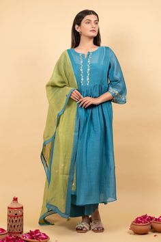 Teal blue anarkali with sequin, thread embroidery in floral pattern on placket and sleeve hem. Paired with flared pant, inner and contrast dupatta. - Aza Fashions Chanderi Salwar Kameez With Embroidered Border And Long Sleeves, Long Sleeve Anarkali Set With Embroidered Border For Navratri, Long Sleeve Sharara With Embroidered Border For Navratri, Long Sleeve Embroidered Sharara For Navratri, Navratri Long Sleeve Embroidered Sharara, Bollywood Style Long Sleeve Anarkali Set With Embroidered Border, Blue Cotton Sharara With Sheer Dupatta, Blue Cotton Anarkali Set With Sheer Dupatta, Blue Anarkali Set With Embroidered Border