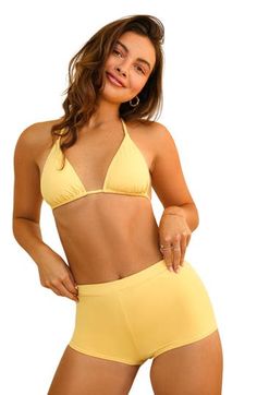 The Farrah Short brings style and comfort without skipping on fun. With its elastic waist, these shorts are the perfect fit for any adventure! 80% Nylon 20% Spandex Imported from Vietnam Booty short coverage Elastic waist Yellow Swimwear With Built-in Shorts For Vacation, Beach Swimwear Shorts In Elastane, Summer Stretch Swimwear, High-waisted Shorts, Elastane Short-length Beachwear Swimwear, Summer Stretch Swimwear High-waisted Shorts, Short Length Elastane Swimwear For Beach, Stretch High-waisted Shorts Swimwear For Summer, Elastane Bottoms For Beach Season Vacation, Elastane Bottoms For Beach Vacation