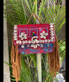 About bag  Indo-gypsy fusion, everyday use hand bag made from Banjara fabrics sourced from Vintage tribal costumes of regions of Rajastan and Gujarat. These are embellished with light catching coins, and intricate bead work tassels. Size - length 15 inches/ width 21 inches Company details:  Company name: Houseoftextile  Contact number: +919784447473  Email id: houseoftextile77@gmail.com  Shipping & custom : Delivery through one of the finest service providers : Skyway, Fedex, UPS  And DHL. Any l Bohemian Shoulder Bag With Tassels, Bohemian Rectangular Bag With Tassels, Bohemian Rectangular Bags With Tassels, Bohemian Satchel Bag With Tassels, Bohemian Satchel With Tassels, Traditional Satchel Beach Bag, Traditional Satchel Bag For Beach, Bohemian Beach Bag For Festivals, Traditional Beach Shoulder Bag With Tassels