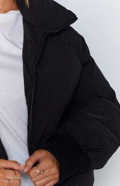 The Remi Puffer Jacket Black is the sleekest puffer jacket on the market! Its crop length and high collar make this winter basic a fashion statement. Wear it with activewear or your casual weekend outfit.


Black puffer jacket

Long sleeve

Zip-up front

Side pockets that zip up

High neck

Elastic cuffs

Black lining

Elastic drawstring around the waist Best Puffer Jacket, Casual Weekend Outfit, Prom Midi Dress, Summer Playsuit, Black Puffer Jacket, Black Puffer, Casual Weekend, Jacket Long, Crop Top Sweater