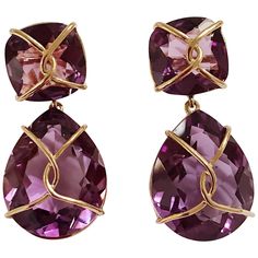 Christina Addison 18kt Yellow Gold Drop Earring with gold wrapped faceted cushion shaped Purple Amethyst top and faceted pear-shaped Purple Amethyst. This elegant earring measures an inch and a half long. The top cushion is shaped Amethyst that measures half an inch wide. The faceted pear shaped Amethyst drop measures an inch and an eighth wide. These earrings can be made for Clip or Pierced earrings. The Christina Addison Fine Jewelry Bespoke Collection is made to order to your ring size. You m Cushion Cut Earrings, Sand Dollar Earrings, Yellow Gold Drop Earrings, Gold Wrap, Cushion Cut Ring, Yellow Gold Earrings, Pink Topaz, Fine Jewelry Collection, Drop Earring