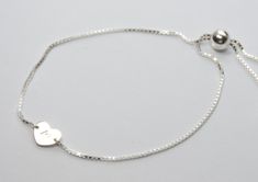 "Sterling silver initial bracelet, Sterling silver expandable heart bracelet This is a great gift. The bracelet will arrive in a nice box tied with a white ribbon. Sterling silver adjustable bracelet is about 8 1/2\" Sterling silver heart disc is about 7mm Sterling silver components To see other Flower girl jewelry click here: https://www.etsy.com/shop/SashJewelry?section_id=12354059&ref=shopsection_leftnav_8 To see Bridesmaid jewelry click here: https://www.etsy.com/shop/SashJewelry?section Adjustable Heart-shaped Sterling Silver Name Bracelet, Adjustable Sterling Silver Heart Name Bracelet, Silver Charm Bracelet With Adjustable Chain For Valentine's Day, Silver Adjustable Double Heart Charm Bracelet, Adjustable Silver Double Heart Charm Bracelet, Adjustable Silver Heart Bracelet For Valentine's Day, Valentine's Day Silver Charm Bracelet With Adjustable Chain, Valentine's Day Adjustable Silver Heart Bracelet, Silver Heart-shaped Name Bracelet In Sterling Silver