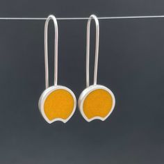 YELLOW crescent earrings... with a modern | retro pop art feel ... sterling silver dangle earrings ... fun, fresh and just a bit mod ....  handmade earrings... sawn, shaped, soldered, sanded, cast, and filled with resin ... sanded again and polished ... ..hand fabricated and colored with ground glass and resin the earrings measure 5/8" wide and  hang 1 1/2" from the curve of the ear wire. ...the perfect gift for someone special... or yourself.  shipped in a gift box. @metalobjects Retro Sterling Silver Earrings For Gift, Retro Sterling Silver Earrings Gift, Modern Yellow Jewelry For Gifts, Modern Yellow Jewelry For Gift, Modern Yellow Nickel-free Jewelry, Minimalist Yellow Sterling Silver Jewelry, Modern Yellow Dangle Earrings, Minimalist Yellow Earrings For Gift, Handmade Retro Jewelry For Everyday Wear