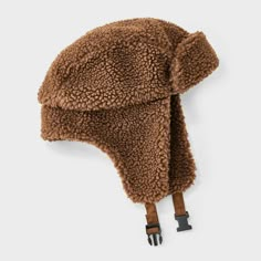 Take on the winter season in style with this Polyester All Over Faux Shearling Trapper Hat from Goodfellow & Co™. Made from a heavyweight woven fabric and filling, this faux shearling trapper hat offers your head and ears all-day cozy comfort. Designed with a chinstrap hook-and-loop fastener for a snug fit, it makes a standout addition to your collection of winterwear. Goodfellow & Co™: Feel good in what you wear, anywhere. Brown Insulated Winter Hat, Brown Aviator Winter Hats, Fall Hats With Faux Fur Lining, Brown Winter Hats, Faux Fur Hat For Fall, Winter Brown Aviator Hats, Fall Faux Fur Hat With Lining, Winter Aviator Hat With Plush Lining, Brown Hat With Plush Lining For Cold Weather