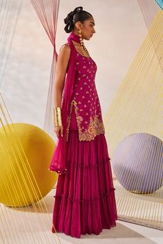 Magenta pink raw silk kurta featuring resham and zardosi hand embroidery. Paired with a chinon chiffon sharara and net dupatta., Fit: Relaxed Pink Sharara With Zari Work Sleeveless, Pink Sharara With Resham Embroidery, Traditional Pink Sleeveless Sharara, Pink Sleeveless Lehenga For Eid, Sleeveless Pink Lehenga For Eid, Pink Sleeveless Sharara For Festivals, Festive Pink Sleeveless Salwar Kameez, Designer Pink Silk Sharara, Pink Sleeveless Sharara For Navratri