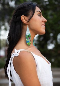 Description No matter where you go, bring a slice of island life with you in the form of our Paradisio beaded earrings! These tropically-inspired pieces are bright, fun, and chill - perfect for lifting up your mood in the office, or for when you want a reminder that there are always good times around the corner. Handmade with meticulous fringe beadwork, they're your passport to tropical bliss. Elevate your style and keep the festive spirit rolling wherever you wander! 🏝 Specifications Size: 11. Single Drop Earring For Vacation, Summer Beach Beaded Earrings With Dangling Beads, Summer Beach Beaded Earrings, Bohemian Dangle Beaded Earrings For Vacation, Beach Earrings With Dangling Beads, Multicolor Summer Earrings, Unique Handmade Earrings For Vacation, Summer Vacation Drop Earrings, Handmade Beachy Earrings For Summer