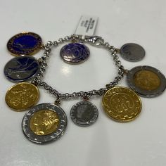 Italian Lire Coin Charm Rolo Bracelet Made In Italy Stamped 925 Brand New 9 Coins Silver Coin-shaped Engraved Bracelets, Formal White Gold Charm Bracelets, Formal White Gold Bracelets With Charms, Luxury Sterling Silver Charm Bracelet, Luxury Silver Chain Bracelet With Charms, Luxury Silver Charm Bracelet With Polished Finish, Silver Luxury Charm Bracelet With Polished Finish, Womens Jewelry Bracelets, Bracelet Making