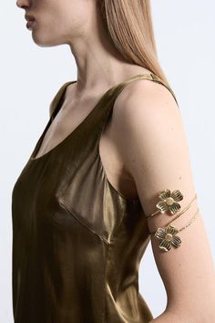 Add Intricate Detail To Any Occasion Look With Our Arm Cuff. Featuring A Large, Floral Design, This Cuff Is Perfect For Injecting Some Personality Into Your Look. Wear Them On Wedding Guest Days, To Party Nights, And Holiday Evenings. Metal Flower Arm Cuff Shimmering, Metallic Colouring Three Dimensional Floral Detailing Unique Cuff Design Statement Large Size Fairy Arm Cuff, Flower Arm Cuff, Gold Arm Cuff, Petite Wedding Guest Dresses, Upper Arm Cuff, Arm Bangles, Upper Arm Cuffs, Latest Bracelets, Cuff Design