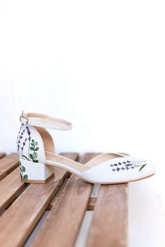 Wedding shoes 'Jasmine' are handcrafted in soft off-white suede and have elegant handmade lavender and eucalyptus embroidery that can be customized to your preference! The heel measures 4.5 cm / 2.2 inches tall. These wedding shoes are designed with a V-notched vamp (v-cut) and closed-toe, making bridal sandals even more elegant and special. Inside there is a soft Memory foam insole, which gives a feeling of additional comfort when walking. Tunit outsole is made of a mixture of leather chips and Summer Wedding Leather Block Heels, Spring Wedding Shoes With Removable Insole And Ankle Strap, White Embroidered Round Toe Heels, Spring Wedding Heels With Floral Embroidery, Low Heel Cream Wedding Shoes For Spring, Cream Low Heel Wedding Shoes For Spring, Wedding Heels With Floral Embroidery And Ankle Strap, Summer Wedding Heels With Floral Embroidery, Spring Wedding Block Heels With Closed Toe