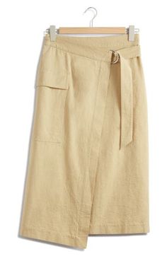 An adjustable D-ring belt and cargo pocket add utilitarian elements to a nonstretch midi skirt finished with an asymmetric hem for contemporary appeal. Attached belt Cargo flap-patch pocket 55% hemp, 45% cotton Dry clean or machine wash, line dry Imported High Waist Cargo Skirt For Work, High-waisted Cargo Skirt For Workwear, High Waist Cargo Skirt With Cargo Pockets For Work, Utility Skirt With Pockets For Work, Chic Wrap Skirt With Pockets For Work, Chic Asymmetrical Wrap Skirt With Pockets, Asymmetrical Workwear Skirt With Side Pockets, Asymmetrical Work Skirt With Side Pockets, Workwear Midi Cargo Skirt