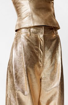 Sparkle meets swagger in wide-legged leather pants presented in a gleaming golden finish. Zip fly with hook-and-bar closure Side-seam pockets Lined Leather Professional leather clean Imported Gold Pants, Waistcoat Dress, Leather Trousers, Tshirt Skirt, Fashion Story, Denim Coat, Dress Trousers, Shirt Skirt, Gold Fashion