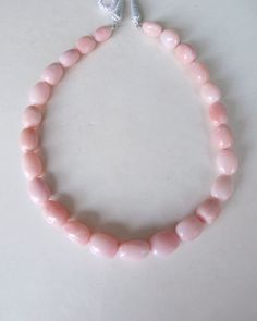 Pink Opal Round Beads For Jewelry Making, Pink Opal Round Beads Necklace, Pink Rondelle Polished Beads Jewelry, Handmade Pink Oval Beads Jewelry, Pink Rondelle Jewelry With Polished Beads, Pink Polished Rondelle Beads Jewelry, Elegant Pink Gemstone Beads, Pink Faceted Oval Beads Jewelry, Pink Oval Faceted Beads Jewelry