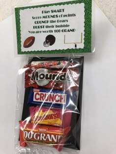 a package of candy is sitting on a table next to a sign that says mouse crunch