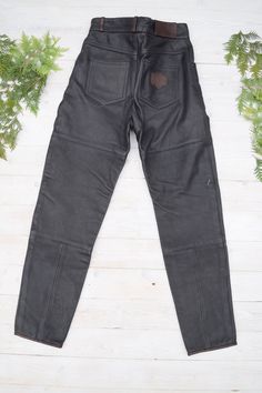 "Strong un and thick leather moto pants in excellent condition. PLEASE CHECK ALL MEASUREMENTS BELLOW: Length: 106 cm / 42\" Waist: 72 cm / 28\" Hips: 102 cm / 40\" Inseam: 77 cm /30\" Fabric: leather, polyester Brand: Frank Thomas Condition: excellent * dry clean only LOOK FOR OTHER COOL VINTAGE CLOTHING HERE: https://www.etsy.com/shop/OnTheRoadStore KEEP IN MIND: Photo might be slightly different from actual item in terms of color due to the lighting during photo shooting or your monitor's disp Black Leather Moto Bottoms, Black Leather Biker Pants, Fitted Leather Biker Pants For Motorcycling, Black Biker Leather Pants For Winter, Biker Style Leather Pants For Streetwear, Black Biker Leather Pants, Fitted Black Moto Leather Pants, Biker Style Full-length Leather Pants For Biker Events, Moto Leather Bottoms