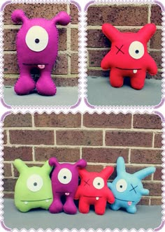 four different colored stuffed animals sitting next to a brick wall