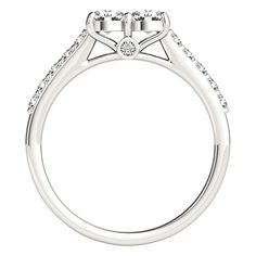 a white gold engagement ring with two diamonds on the side