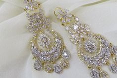 White CZ Diamond Earrings Indian Pakistani bridesmaid wedding jewelry in silver plating Indian Jewelry are always a part of all the Indian celebration around the globe . One definitely complete her look once they own it . Beautiful  Indian cz earrings are plated in rhodium plating for longer lasting. This artistic Earrings looks beautiful  and elegant perfect for all occasion on any outfits you choose to wear (saree, salwar suits, lenga, etc.) *High quality craftsmanship 100% satisfaction guarantee  *Plated in rhodium plating *Earring Closure screw back on earring  *base metal for earrings is brass * Earring length 7cm *Earring width 3cm  *package include earrings  *ready to ship from Houston TX United States GIFT- It comes in gift box perfect for gifting to your mom , sister, in laws, fri Indian Celebration, Wedding Jewelry Indian, Diamond Earrings Indian, Artistic Earrings, Jewelry Pakistani, Earrings Indian, Bollywood Jewelry, Pakistani Jewelry, Indian Earrings