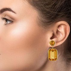 Make a bold statement with the Pietra Drop Earrings in Citrine by Piranesi. Featuring approximately 37.00 carats of brilliantly cut round and emerald-cut yellow citrine stones set in 18K yellow gold, these earrings are sure to turn heads. The vibrant yellow hue of the citrine stones paired with the warmth of the 18K yellow gold creates an exquisite and timeless look that will elevate any outfit. The Pietra Drop Earrings in Citrine are the perfect addition to any fine jewelry collection, whether Citrine Jewelry, Citrine Earrings, Yellow Citrine, Citrine Stone, Fine Jewelry Collection, Green Amethyst, Stunning Earrings, Small Earrings, Smokey Quartz