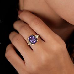 Don't miss this opportunity to own this beautiful gemstone ring! => Gemstone Type - Amethyst, Clear Quartz => Gemstone Cut - Faceted => Gemstone Size - 8*10 mm, 2 mm => Total Number of Gemstones - 7 => Metal Type - 14k Gold Filled (Tarnish Resistant and Nickel Free) - also available in 925 sterling silver and 14ksolid gold * Please contact me for pricing on sizes larger than 11 * ~ Feel free to ask me about custom made designs. ❏ Replacements and custom orders: ✪ 925 sterling silver - no additio Luxury Sapphire Ring With Emerald Cut And Gemstone Accents, Luxury Emerald Cut Sapphire Ring With Gemstone Accents, Luxury Emerald-cut Sapphire Ring With Gemstone Accents, Luxury Rings With Diamond Accents And Rectangular Stone, Exquisite Diamond Open Ring With Gemstone, Luxury Rings With Rectangular Diamond Accents, Luxury Rings With Gemstone Accents For Gift, Exquisite Diamond Ring With Gemstone In Open Style, Elegant Rectangular Diamond Ring With Accent Stones