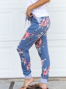 These comfy Floral Lounge pants are a MUST have! The drawstring waist and pockets are just some of the great features. Great for lounging around the house AND are cute enough to run errands. Sizing Small 0-4 Medium 6-8 Large 10-12 XL 12-14 Model is 5'6" wearing small Blue Sweatpants With Elastic Waistband, Blue Fall Sweatpants With Elastic Waistband, Comfy Drawstring Pants For Lounging, Comfy Lounging Pants With Drawstring, Comfy Joggers With Pockets For Spring, Blue Joggers For Fall Loungewear, Comfy Joggers With Comfort Waistband For Spring, Comfy Sweatpants With Comfort Waistband For Spring, Comfy Spring Joggers With Comfort Waistband